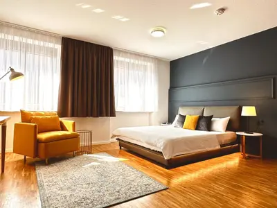 Ein Bett oder Betten in einem Zimmer der Unterkunft Stadthaus Neckarsulm serviced apartments - Stadthaus Schrade