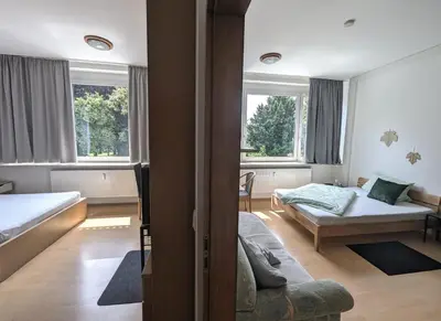 Ein Bett oder Betten in einem Zimmer der Unterkunft Pension am Park