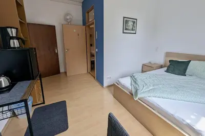 Ein Bett oder Betten in einem Zimmer der Unterkunft Pension am Park