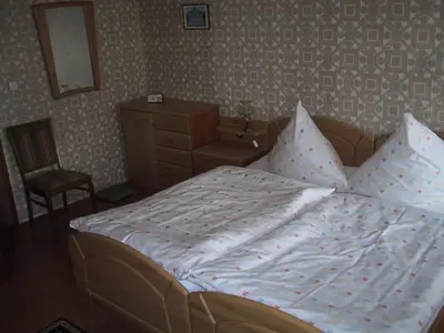 Ein Bett oder Betten in einem Zimmer der Unterkunft Alte Försterei