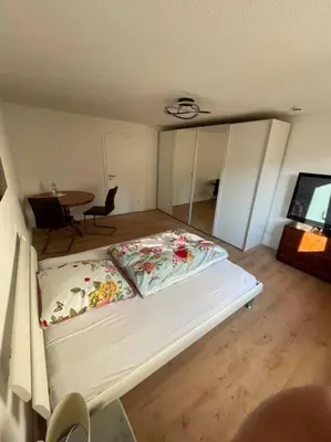 Ein Bett oder Betten in einem Zimmer der Unterkunft Kasa Klemm - helle und zentral gelegene Wohnung