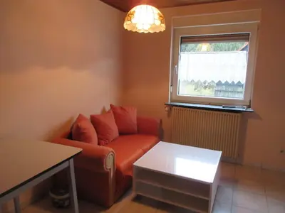 Ein Sitzbereich in der Unterkunft Ferienwohnung in Waldnähe