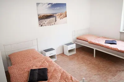 Ein Bett oder Betten in einem Zimmer der Unterkunft Boardinghouse in Mörfelden-Walldorf