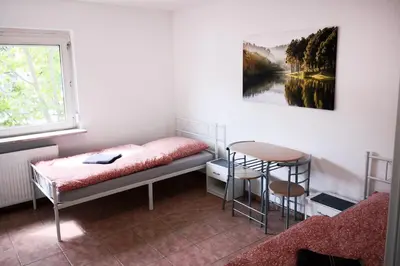 Ein Bett oder Betten in einem Zimmer der Unterkunft Boardinghouse in Mörfelden-Walldorf