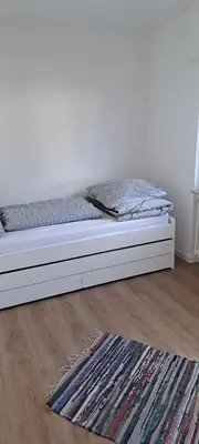 Ein Bett oder Betten in einem Zimmer der Unterkunft ~Ferienwohnung Sandhausen / HD~