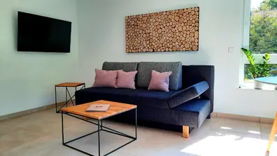 Ein Sitzbereich in der Unterkunft Ferienappartement am Slevogtweg