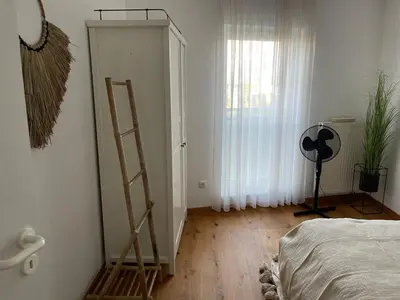 Ein Bett oder Betten in einem Zimmer der Unterkunft Ferienwohnung in Maikammer