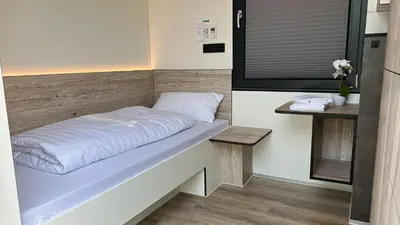 Ein Bett oder Betten in einem Zimmer der Unterkunft Roatel Gau-Bickelheim A61 my-roatel-com