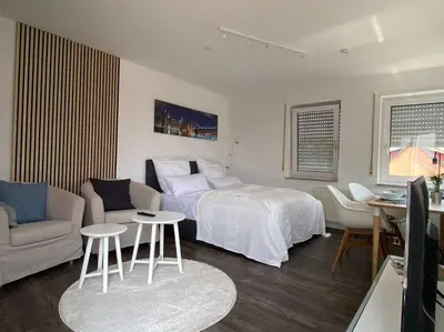 Ein Bett oder Betten in einem Zimmer der Unterkunft Hübsche Wohnung mit Balkon für 1-2 Personen - Einzelbetten