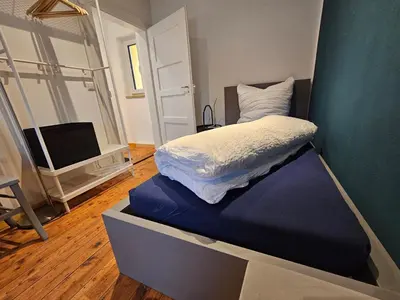 Ein Bett oder Betten in einem Zimmer der Unterkunft Kiwihof Ferienhaus Südpfalz