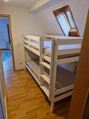 Ein Bett oder Betten in einem Zimmer der Unterkunft Ferienwohnung Blumenshein bei Speyer Karlsruhe Familienfreundlich 5 Pers