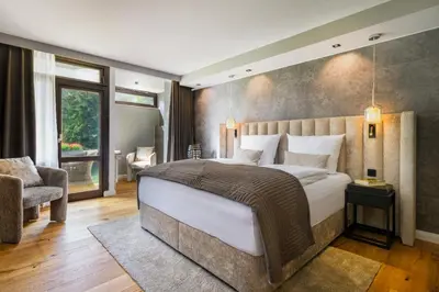 Ein Bett oder Betten in einem Zimmer der Unterkunft Hotel Luisenpark
