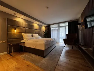Ein Bett oder Betten in einem Zimmer der Unterkunft Hotel Luisenpark