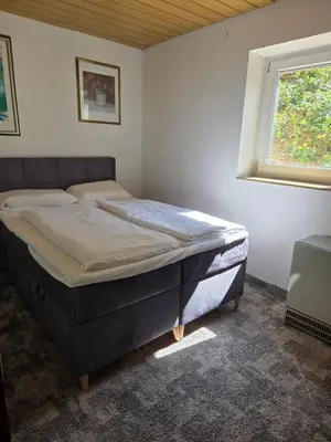 Ein Bett oder Betten in einem Zimmer der Unterkunft Ferienwohnung Freudenberg