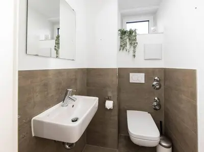Ein Badezimmer in der Unterkunft Stadthaus Neckarsulm serviced apartments – Penthouse Erlenbach