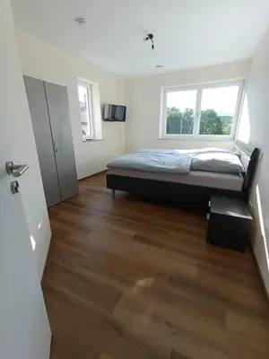 Ein Bett oder Betten in einem Zimmer der Unterkunft Weinrebenblick