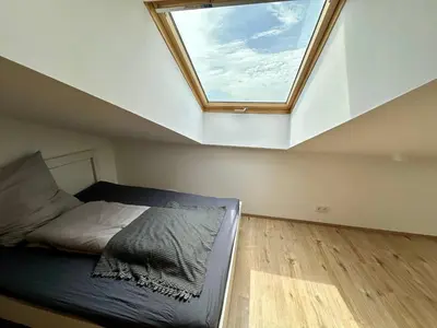 Ein Bett oder Betten in einem Zimmer der Unterkunft Rhein Quartier - Biebesheim