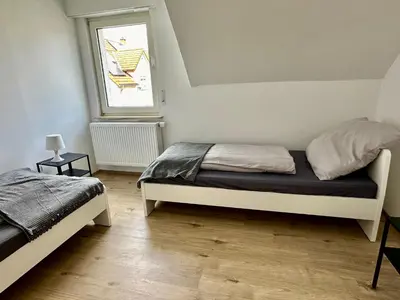 Ein Bett oder Betten in einem Zimmer der Unterkunft Rhein Quartier - Biebesheim