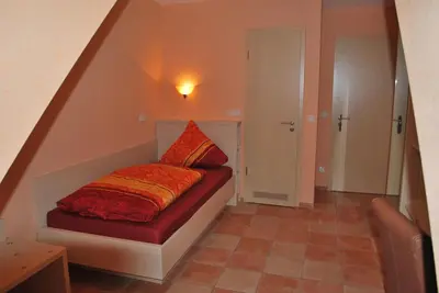 Ein Bett oder Betten in einem Zimmer der Unterkunft Hotel Gasthof “Goldener Engel”