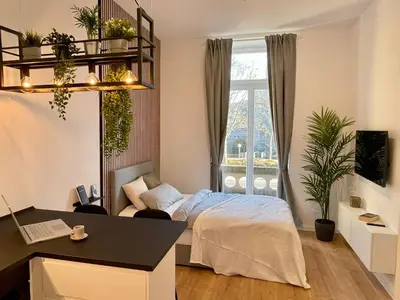 Ein Bett oder Betten in einem Zimmer der Unterkunft Modernes Apartment im Zentrum von Karlsruhe