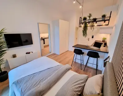 Ein Bett oder Betten in einem Zimmer der Unterkunft Modernes Apartment im Zentrum von Karlsruhe