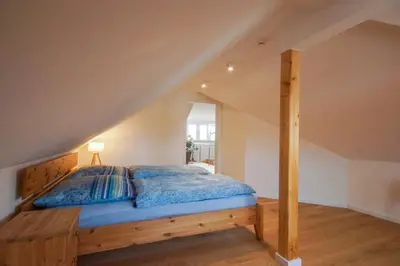 Ein Bett oder Betten in einem Zimmer der Unterkunft Modernes und helles Apartment im Loft Stil