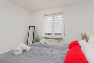 Ein Bett oder Betten in einem Zimmer der Unterkunft Roomfall Apartment Sinsheim mit TG & Wi-Fi & Balkon