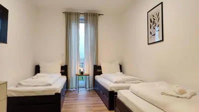 Ein Bett oder Betten in einem Zimmer der Unterkunft Hygge Home - mit Garten und Stellplatz für Feriengäste-, Monteure / Netflix / 10 min. zur Sinsheim Therme und zur Autobahn