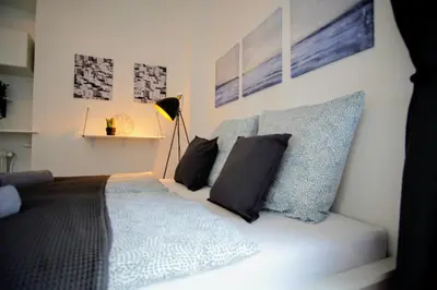 Ein Bett oder Betten in einem Zimmer der Unterkunft LENASTAY I NostalgieApartment I Innenstadt