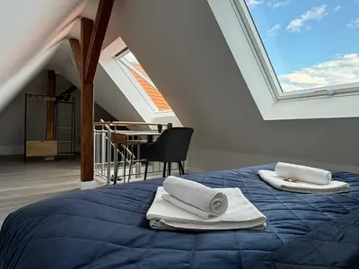 Ein Bett oder Betten in einem Zimmer der Unterkunft SCHLOSSBERG RESIDENCES - Superior Design-Apartments mit Schlossblick für bis zu 12 Personen