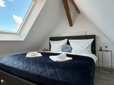 Ein Bett oder Betten in einem Zimmer der Unterkunft SCHLOSSBERG RESIDENCES - Superior Design-Apartments mit Schlossblick für bis zu 12 Personen