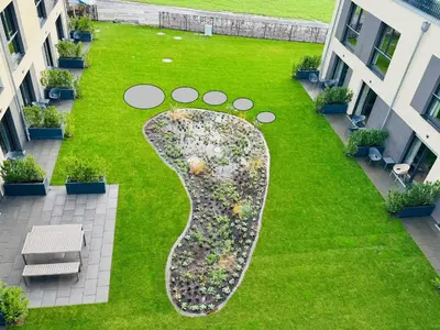 Ein Garten an der Unterkunft Fair n Square Hotel 24 Stunden Self-Check In