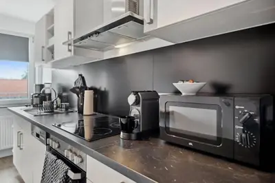 Küche/Küchenzeile in der Unterkunft Amalfi Apartments A01 - gemütliche 2 Zi-Wohnung mit Boxspringbetten und smart TV