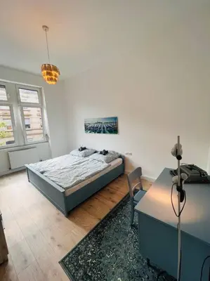 Ein Bett oder Betten in einem Zimmer der Unterkunft Künstlerisches Apartment