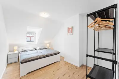 Ein Bett oder Betten in einem Zimmer der Unterkunft Casa Bergstraße 3