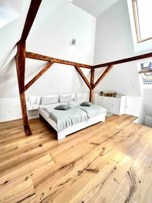 Ein Bett oder Betten in einem Zimmer der Unterkunft Altbauvilla im Herzen von Lorsch