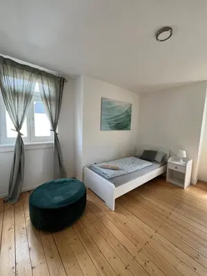 Ein Bett oder Betten in einem Zimmer der Unterkunft Altbauvilla im Herzen von Lorsch