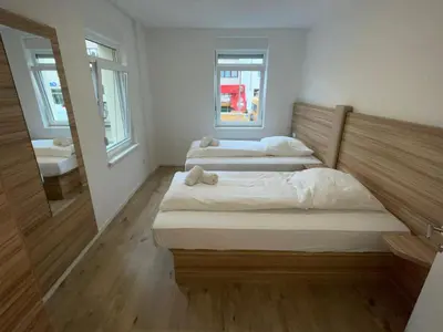 Ein Bett oder Betten in einem Zimmer der Unterkunft Timeless: Große Moderne 4 Zimmer Wohnung
