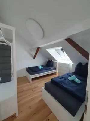 Ein Bett oder Betten in einem Zimmer der Unterkunft 4.OG/Maisonette-Wohnung neu/4-Zimmer/Weststadt