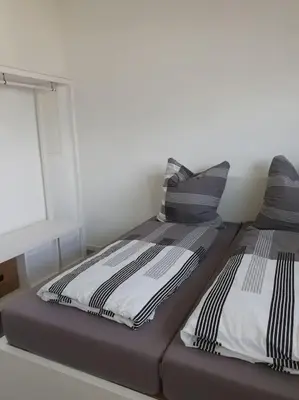 Ein Bett oder Betten in einem Zimmer der Unterkunft Moderne 2 Zimmerwohnung/ Eggenstein/nähe KIT Nord
