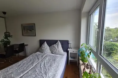 Ein Bett oder Betten in einem Zimmer der Unterkunft Exklusive Wohnung mit herrlicher Terrasse und Garten