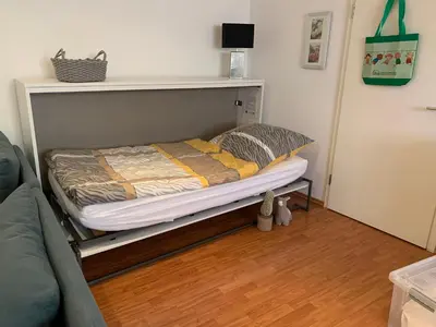 Ein Bett oder Betten in einem Zimmer der Unterkunft Wohnen am historischen Rathaus