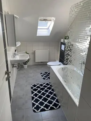 Ein Badezimmer in der Unterkunft Apartment Delux mit 4 Schlafzimmer