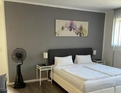 Ein Bett oder Betten in einem Zimmer der Unterkunft HD City Apartments