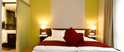 Ein Bett oder Betten in einem Zimmer der Unterkunft Weinhotel Kaisergarten