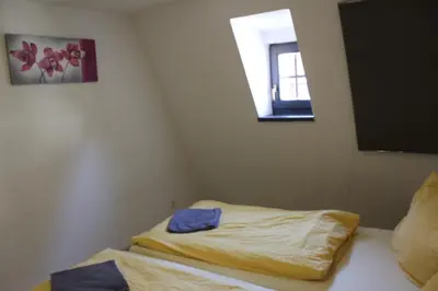 Ein Bett oder Betten in einem Zimmer der Unterkunft Ferienhaus Eberbach