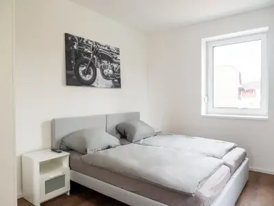 Ein Bett oder Betten in einem Zimmer der Unterkunft Appartmenthaus Karlsbad