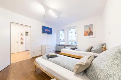 Ein Bett oder Betten in einem Zimmer der Unterkunft NEW Luxury Apartment in Heilbronn, Ludwigsburg, Backnang, Stuttgart