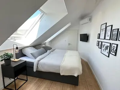 Ein Bett oder Betten in einem Zimmer der Unterkunft Stylisches Apartment in zentraler Lage - mit Klima