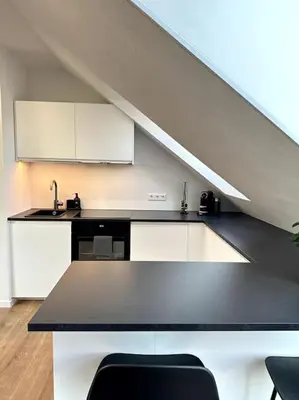 Küche/Küchenzeile in der Unterkunft Stylisches Apartment in zentraler Lage - mit Klima